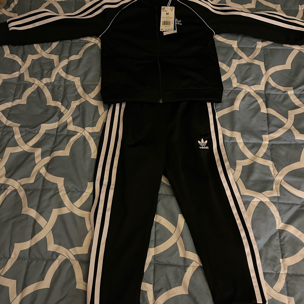 Black kids Adidas sweatsuit.